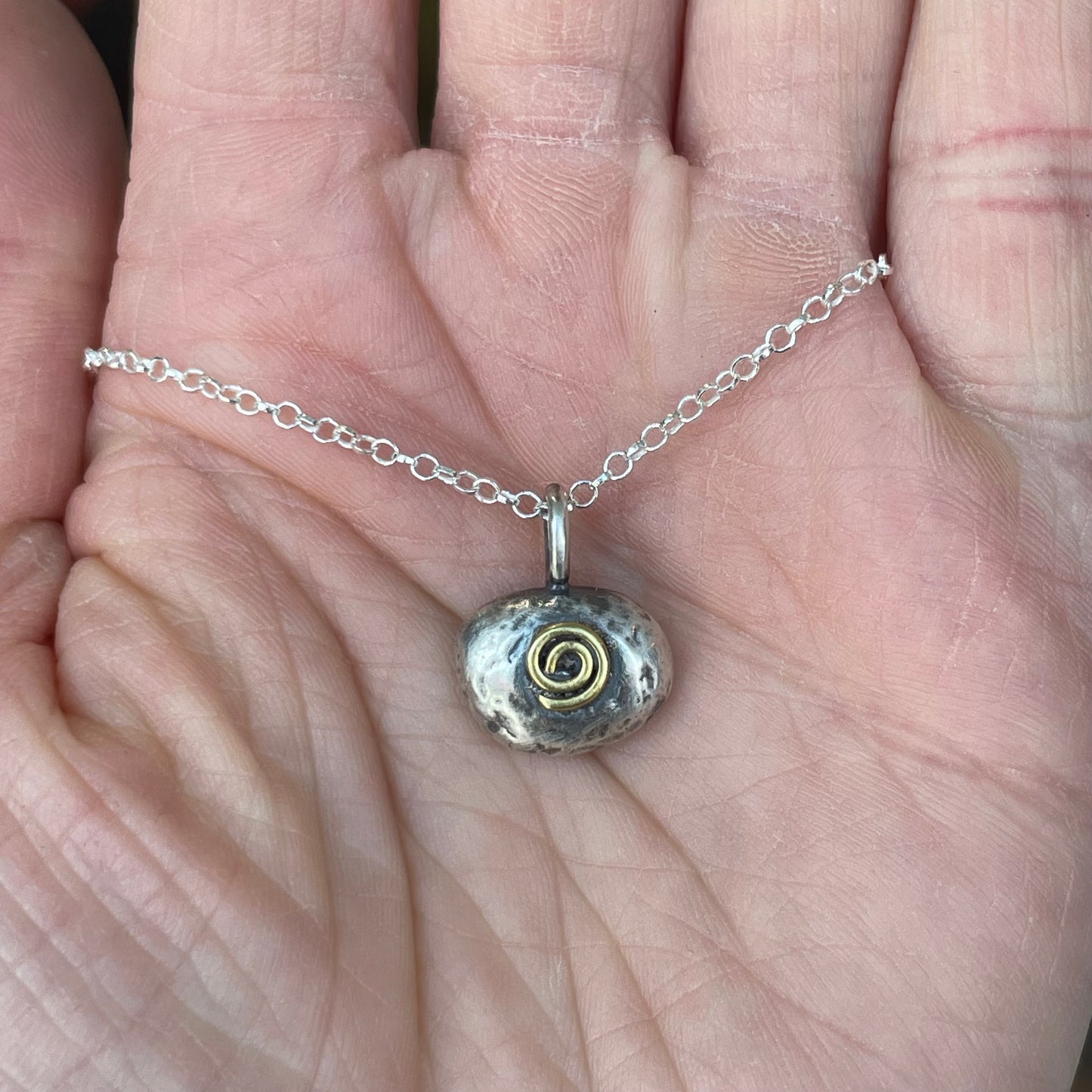 Sterling and brass free form spiral pendant